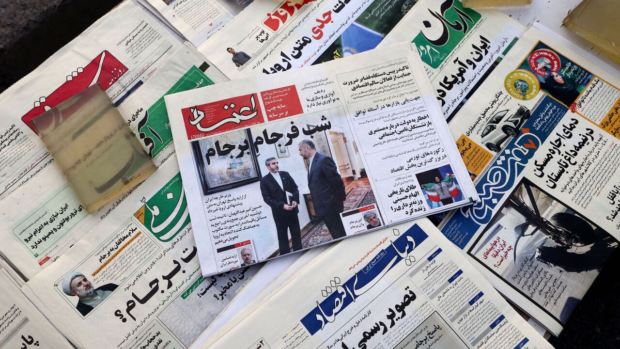 A picture shows a newspaper stall with a view of Etemad newspaper's front page bearing a title reading in Farsi "The night of the end of the JCPOA ", and cover photos of Iran's Foreign Minister Hossein Amir-Abdollahian his deputy and chief nuclear negotiator Ali Bagheri Kani, in the capital Tehran on August 16, 2022. 