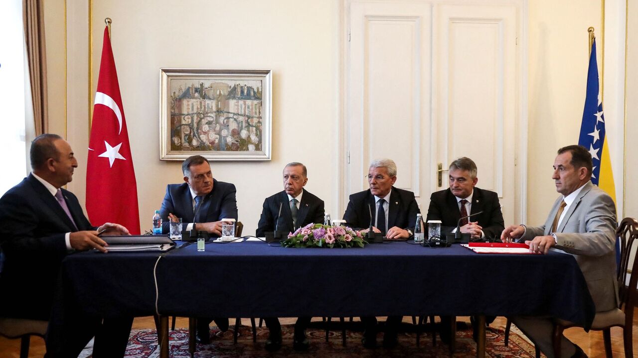 (From L-R) Turkey's President Recep Tayyip Erdogan (3rd-L) and Foreign Minister Mevlut Cavusoglu (L) attend a meeting with members of Bosnia and Herzegovina's tripartite presidency Sefik Dzaferovic (3rd-R), Milorad Dodik (2nd-L) and Zeljko Komsic (2nd R) and Bosnian Security Minister Selmo Cikotic (R) in Sarajevo on Sept. 6, 2022.