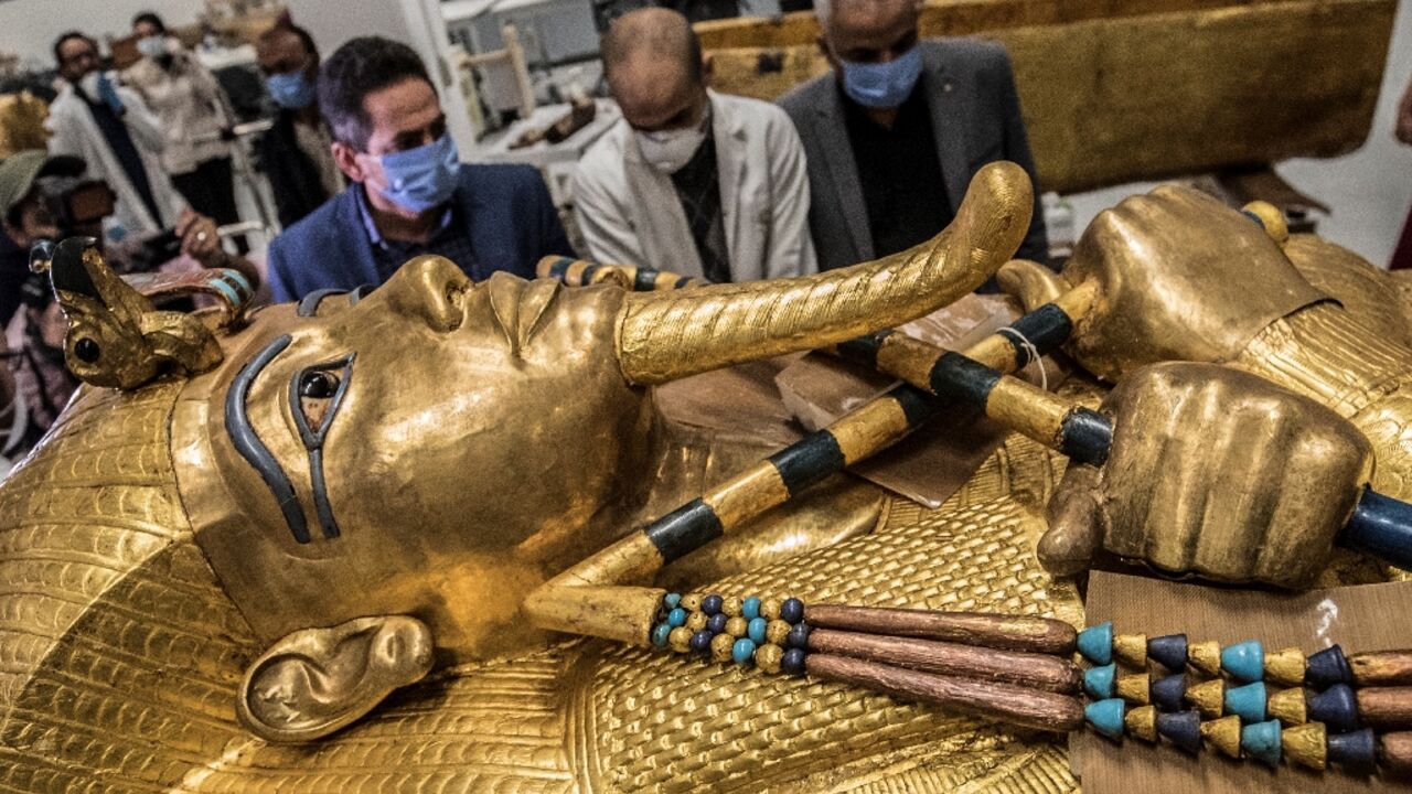 The golden sarcophagus of the Egyptian pharaoh Tutankhamun in a restoration lab at the newly-built Grand Egyptian Museum in Giza 