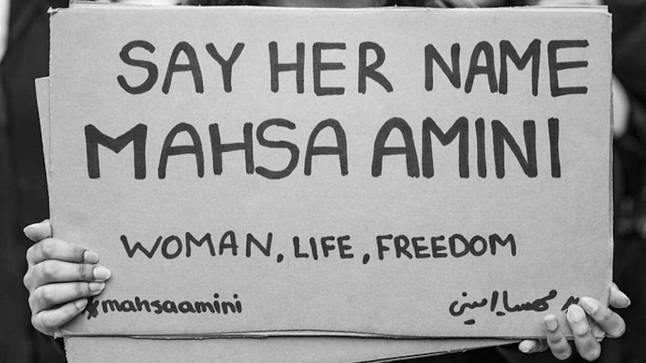 Banner supporting Mahsa Amini.