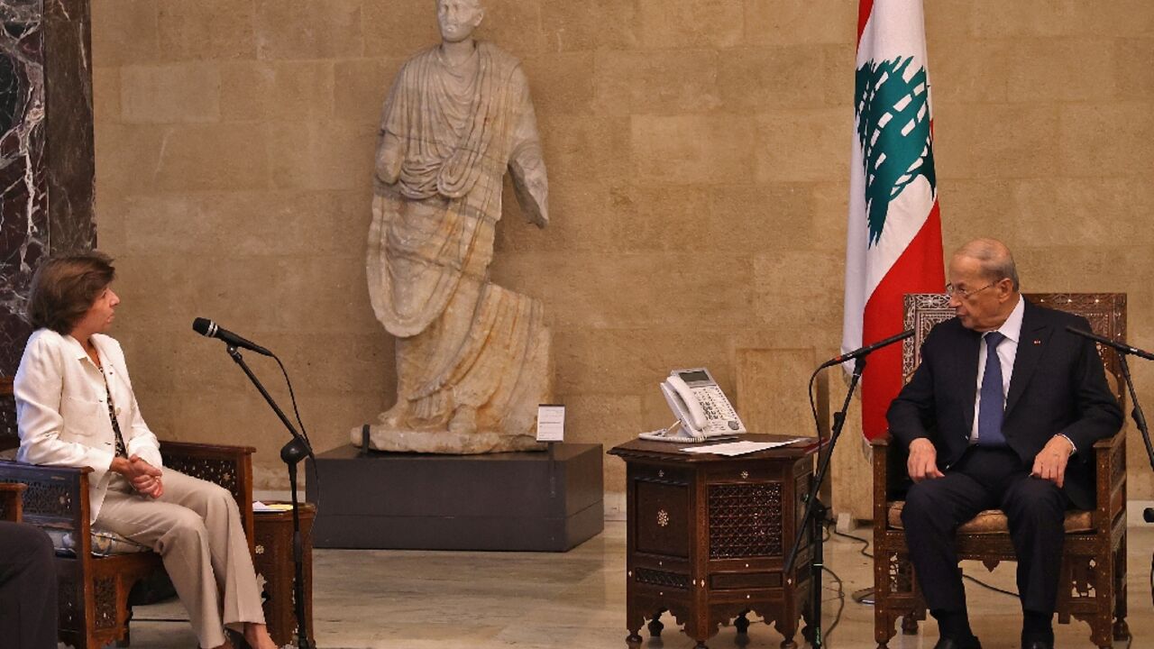 Lebanon's President Michel Aoun (R) meets with France's Foreign and European Affairs Minister Catherine Colonna in Baabda, east of the capital Beirut
