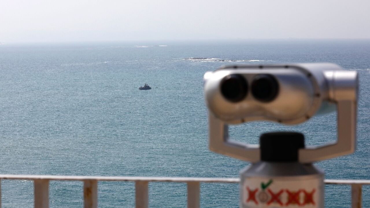 Israeli Navy vessels patrol Mediterranean waters off Israel's crossing at Rosh Hanikra, known in Lebanon as Ras al-Naqura, a border area between the two coutries on October 4