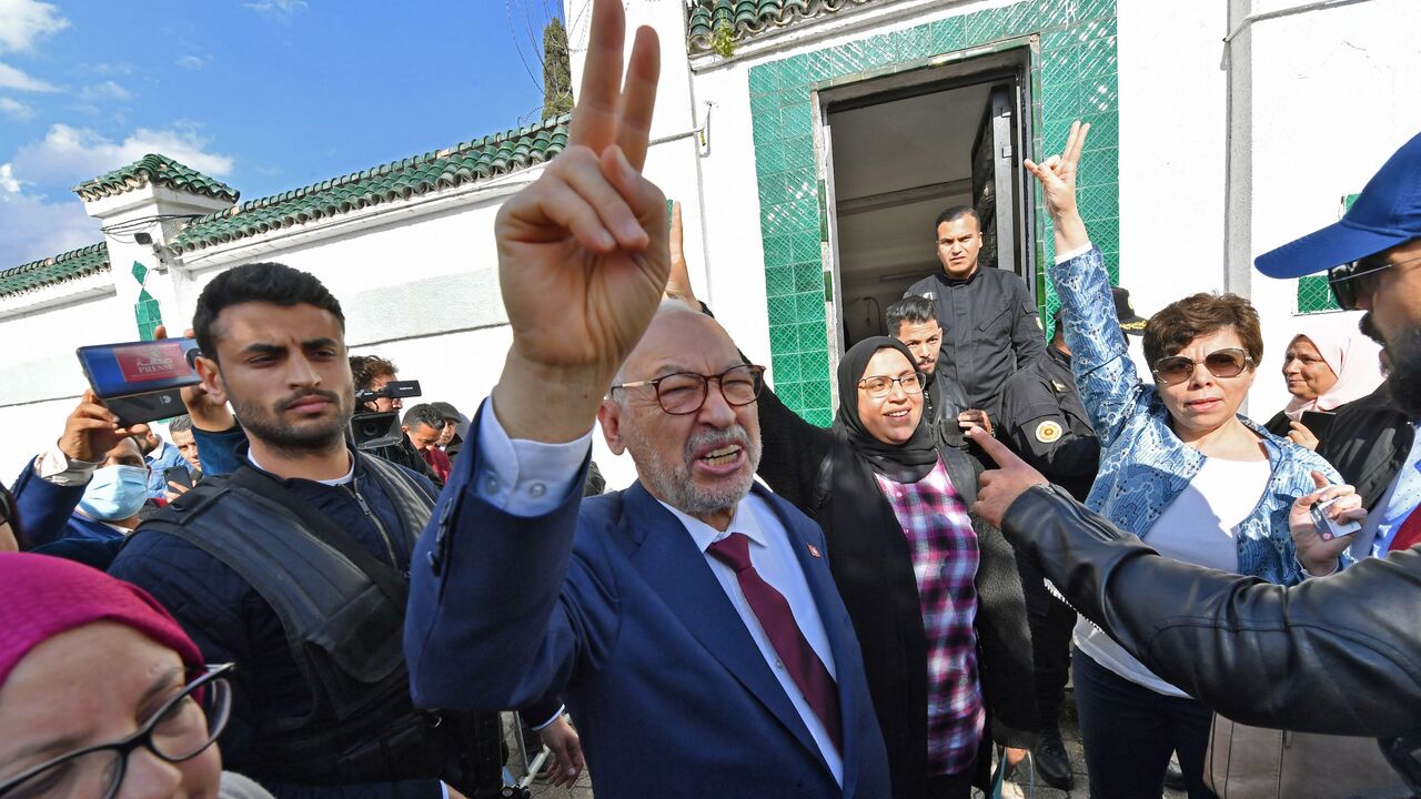 Tunisia's Speaker of the Parliament Rached Ghannouchi flashes the victory sign as he arrives for questioning at the judicial police headquarters in the capital Tunis, on April 1, 2022. 