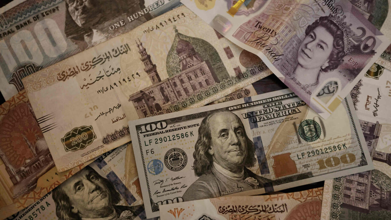 The Egyptian pound, British pound sterling and US dollar banknotes are seen in this photo, Aug. 25, 2022.