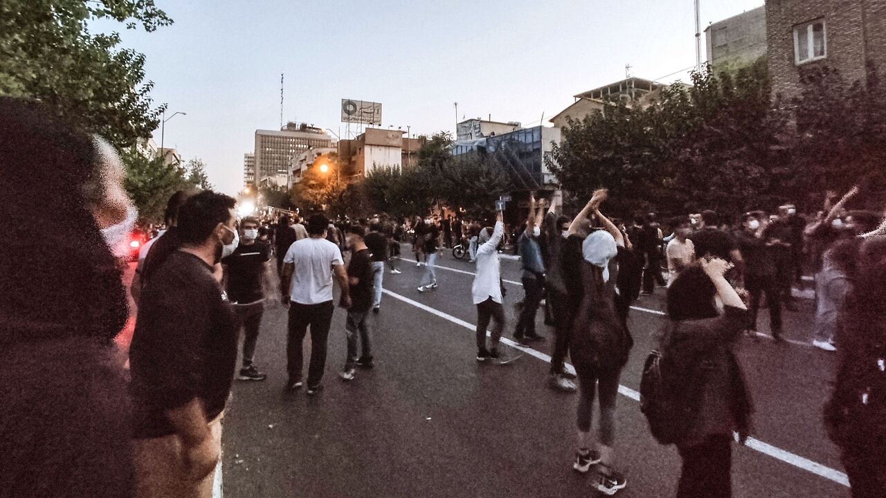 A picture obtained by AFP outside Iran on Sept. 21, 2022, shows Iranian demonstrators taking to the streets of the capital Tehran during a protest for Mahsa Amini, days after she died in police custody. 