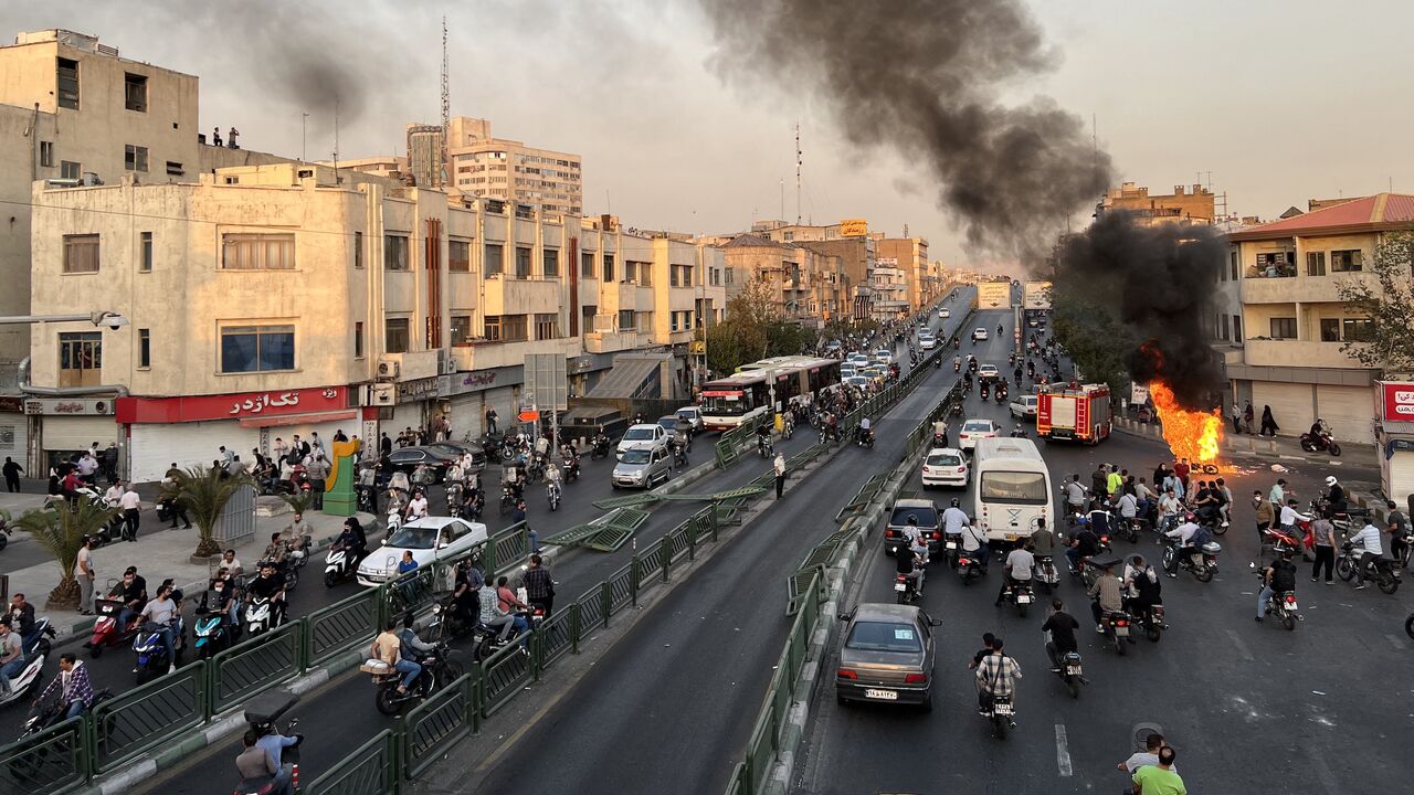 A picture obtained by AFP outside Iran, reportedly shows a motorcycle on fire in Tehran, on Oct. 8, 2022.