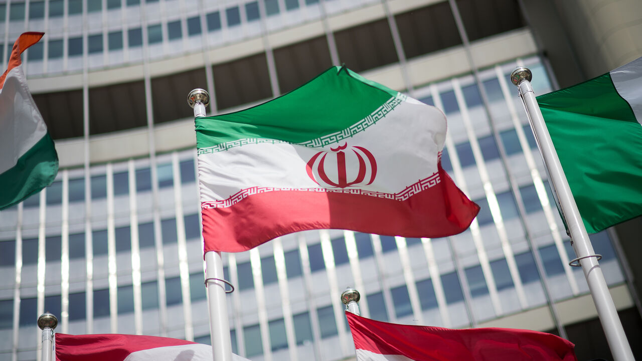  The flag of Iran is seen in front of the building of the International Atomic Energy Agency (IAEA) Headquarters ahead of a press conference by Rafael Grossi, Director General of the IAEA, about the agency's monitoring of Iran's nuclear energy program on May 24, 2021 in Vienna, Austria. 