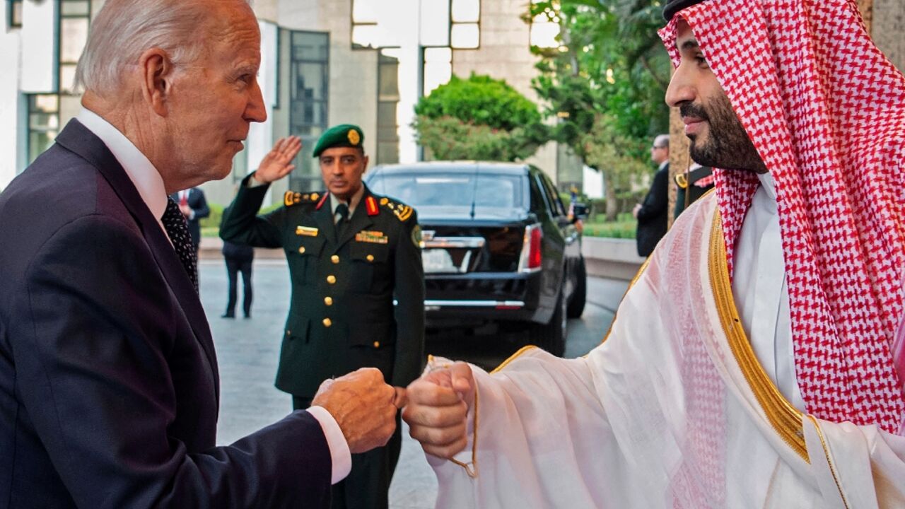 Saudi Crown Prince Mohammed bin Salman bumps fists with US President Joe Biden at Al-Salam Palace in the Red Sea port of Jeddah on July 15, 2022