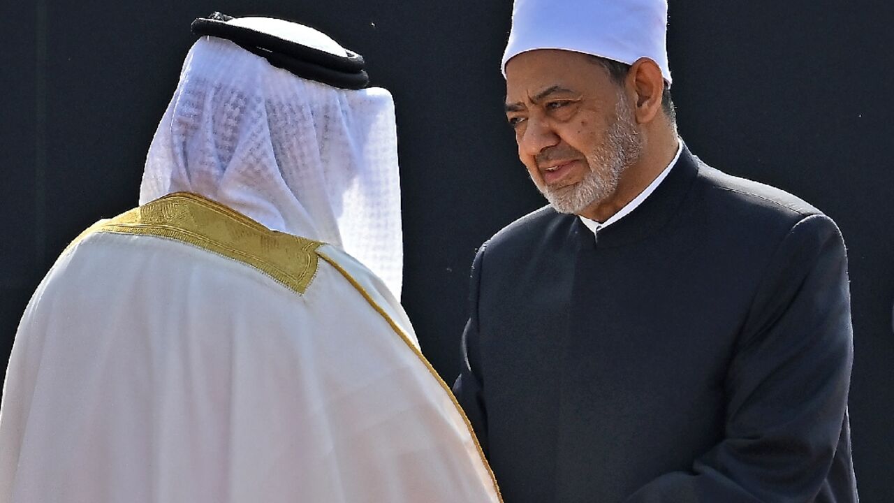 The grand imam of Egypt's Al-Azhar mosque, Sheikh Ahmed al-Tayeb (R), was welcomed by Bahrain's King Hamad bin Isa al-Khalifa (L) 