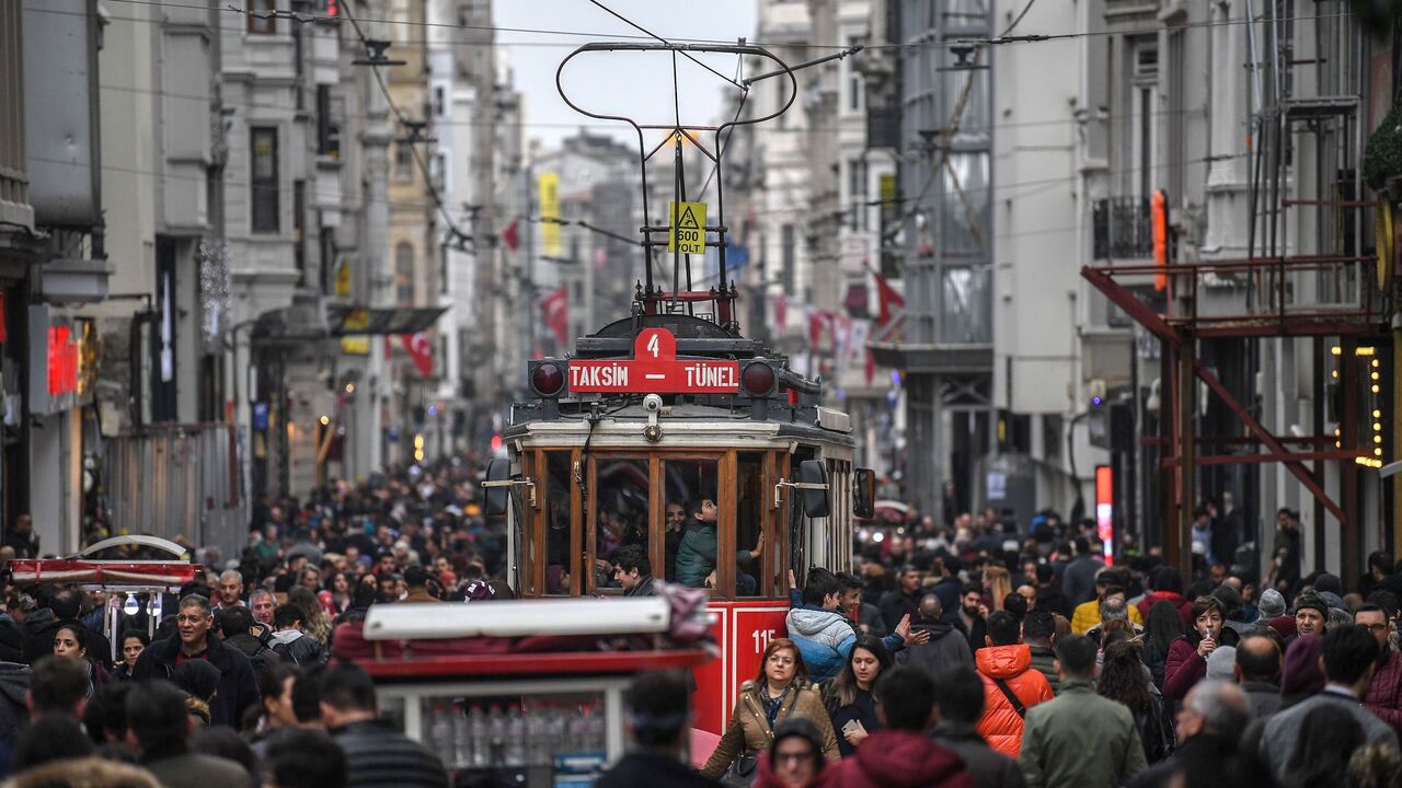 A tramway drives through a crowd in Istiklal avenue on Jan. 25, 2019 in central Istanbul.
