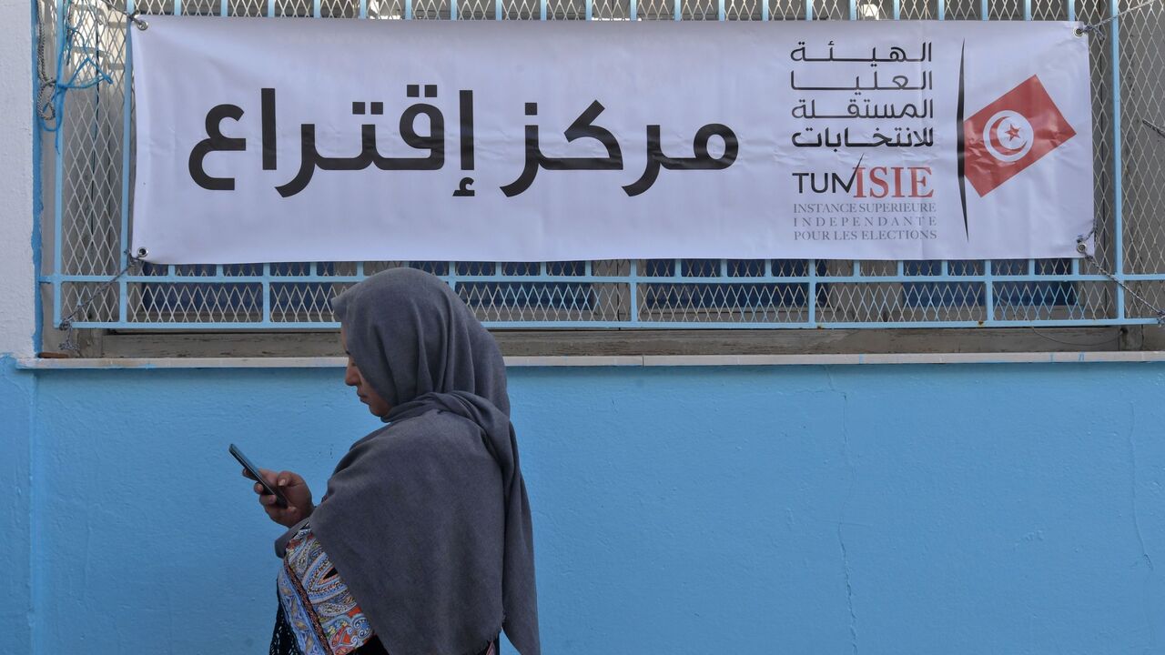 A Tunisian voter waits outside a polling station in Tunis on Oct. 13, 2019.
