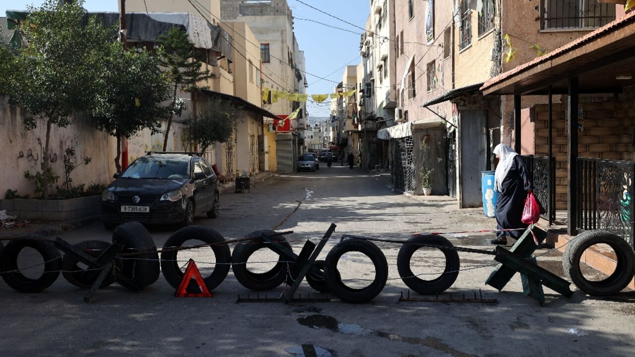 A street barricade set up by Palestinians in anticipation of an Israeli army raid in the city of Jenin in the occupied West Bank on November 23, 2022