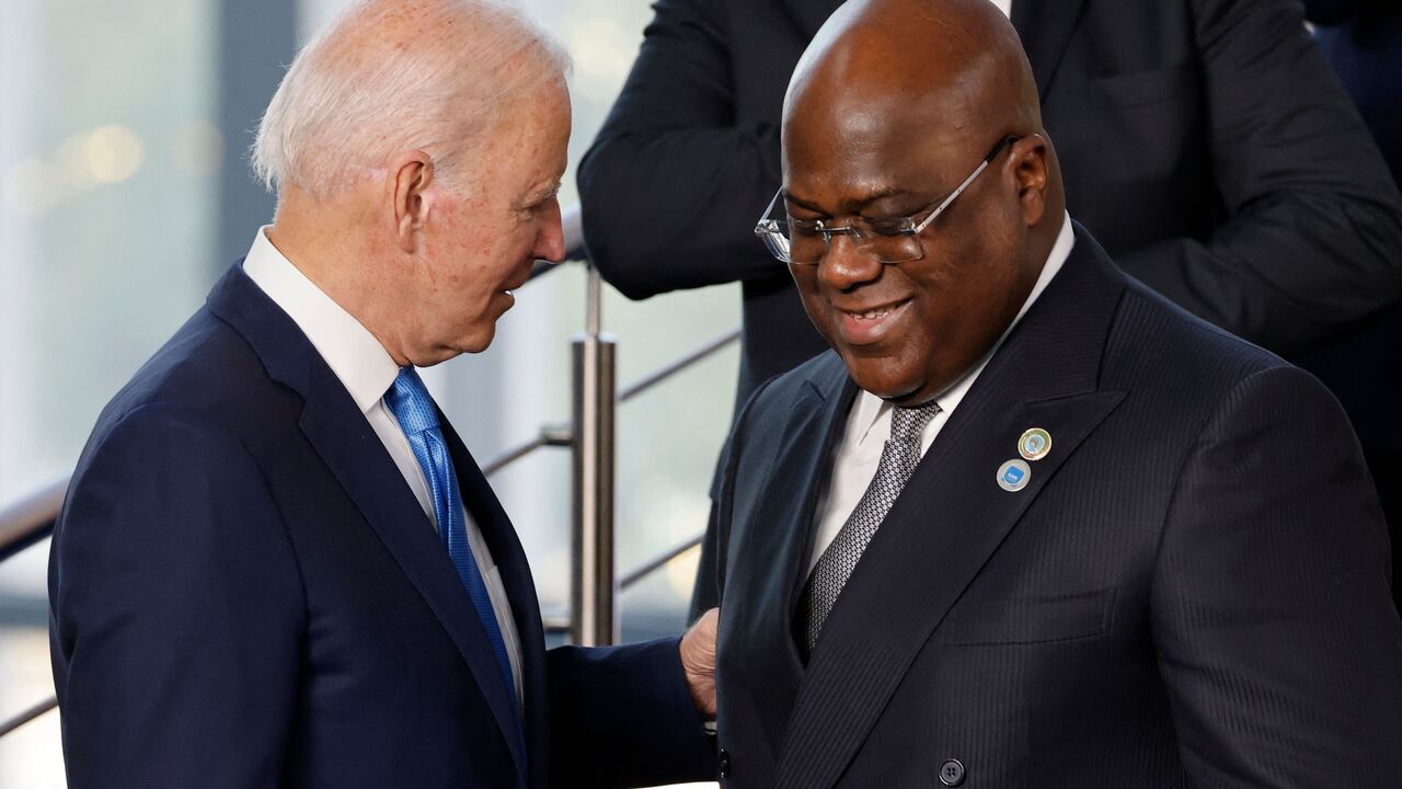 US President Joe Biden (L) speaks with DR Congo President Felix Tshisekedi at the start of the G20 Summit at the convention center "La Nuvola" in the EUR district of Rome on October 30, 2021. (Photo by LUDOVIC MARIN/POOL/AFP via Getty Images)