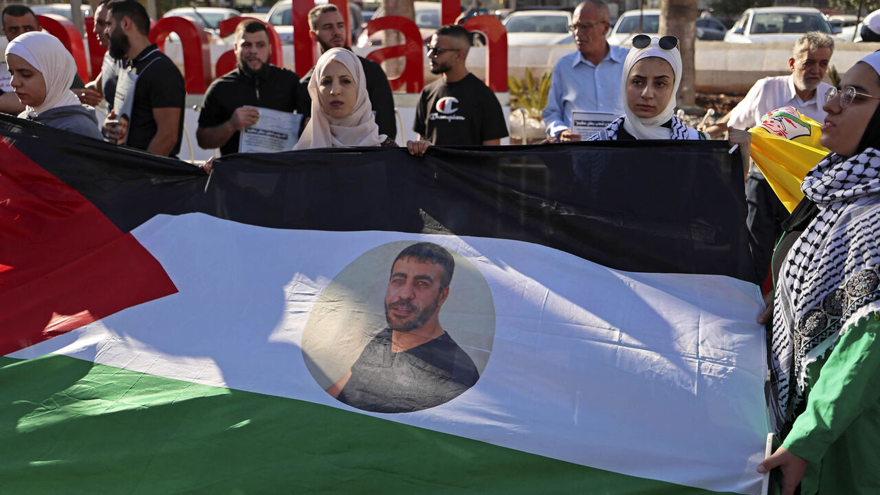 Palestinians take part in a demonstration demanding the release of Nasser Abu Hamid, a Palestinian prisoner held by Israel who has cancer, Ramallah, West Bank, Sept. 21, 2022.