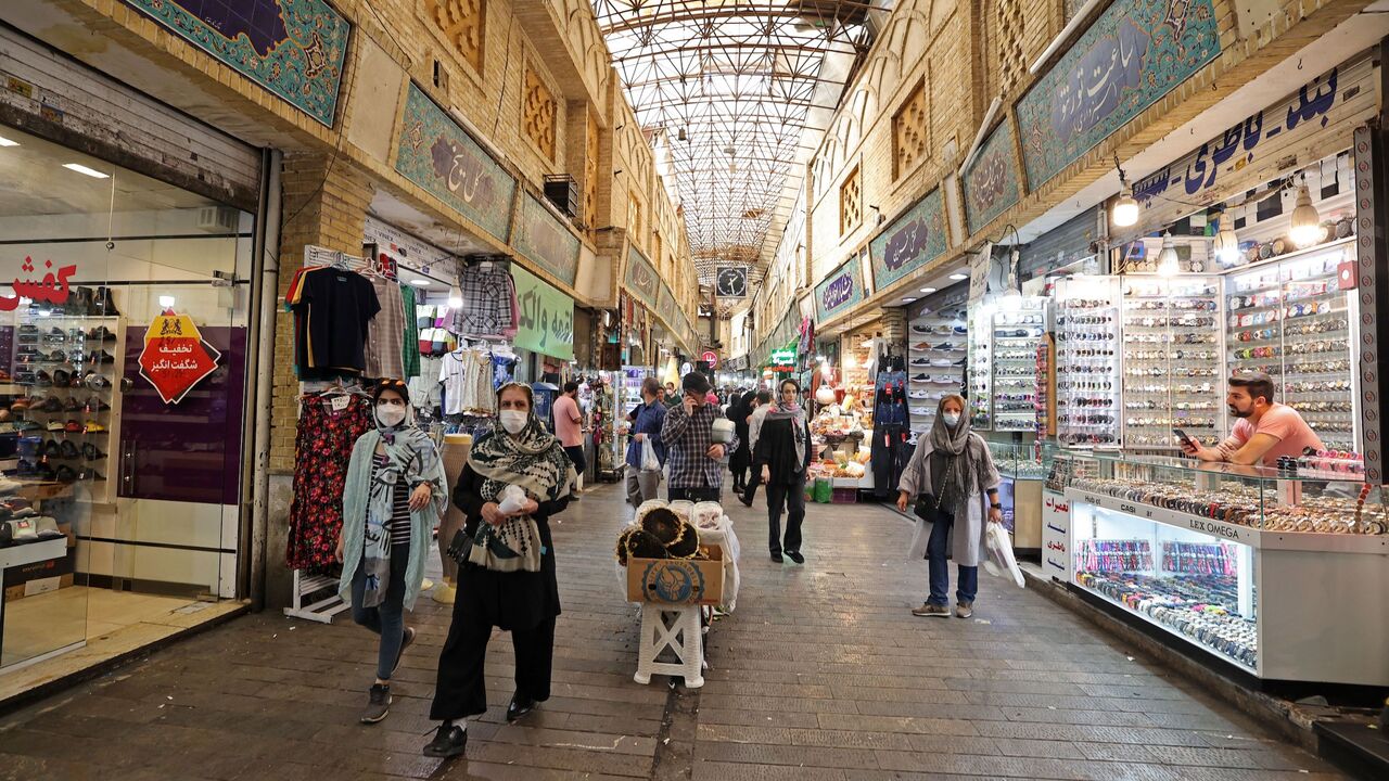 Iranian women shop at the Tajrish traditional bazaar in the capital Tehran on Oct. 2, 2022. This week many Iranian business owners across the country have closed their doors as part of a widespread strike.