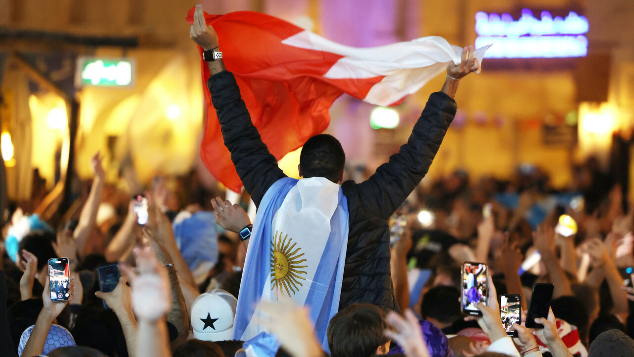 DOHA, QATAR - DECEMBER 17: Fans of Argentina gather at Souk Waqif to show support to their team on the day before the final match of the FIFA World Cup Qatar 2022 against France on December 17, 2022 in Doha, Qatar. (Photo by Mohamed Farag/Getty Images,)