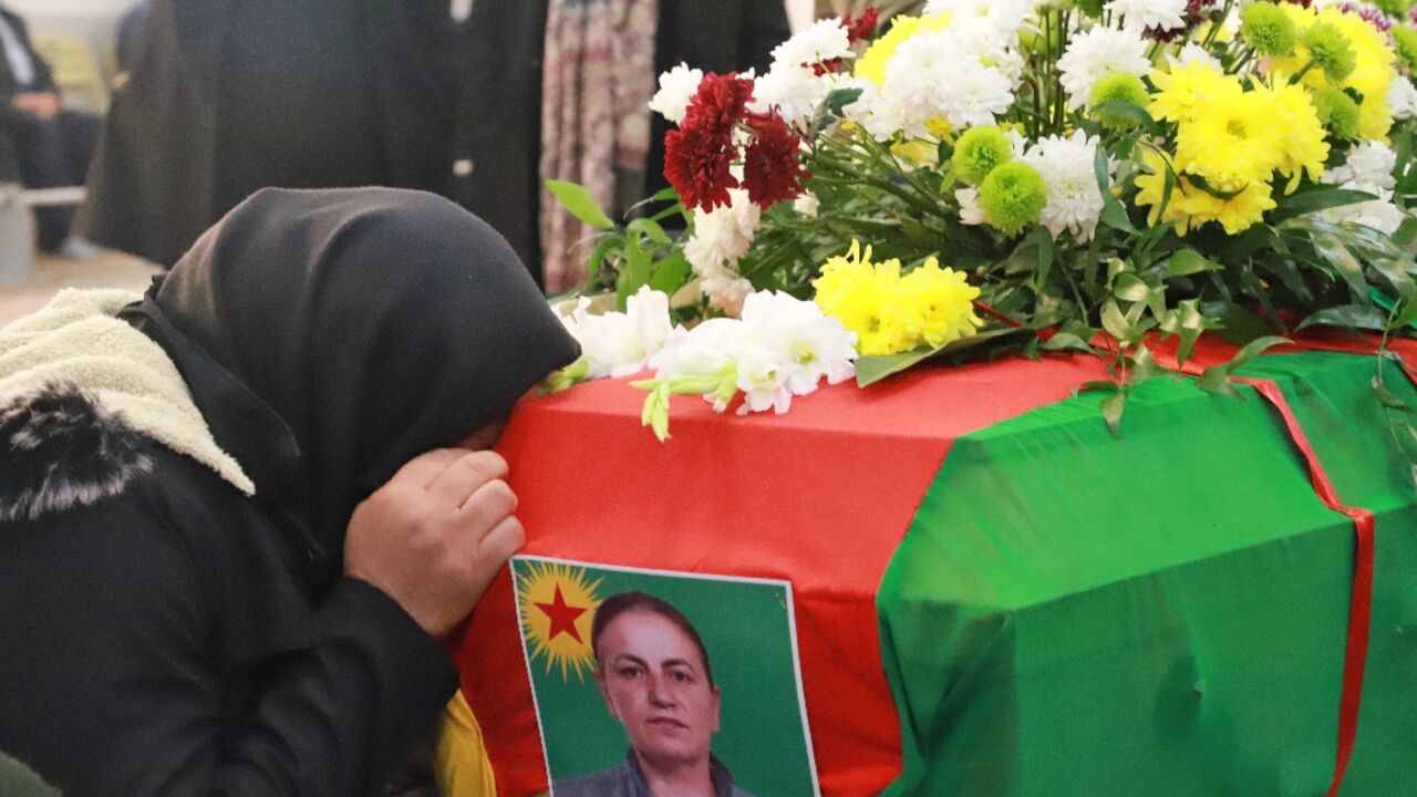 Iraqi Kurds attend the funeral of Emine Kara, a Kurdish woman who was killed during a shooting attack in Paris last month, in the Kurdish city of Sulaimaniyah in northern Iraq