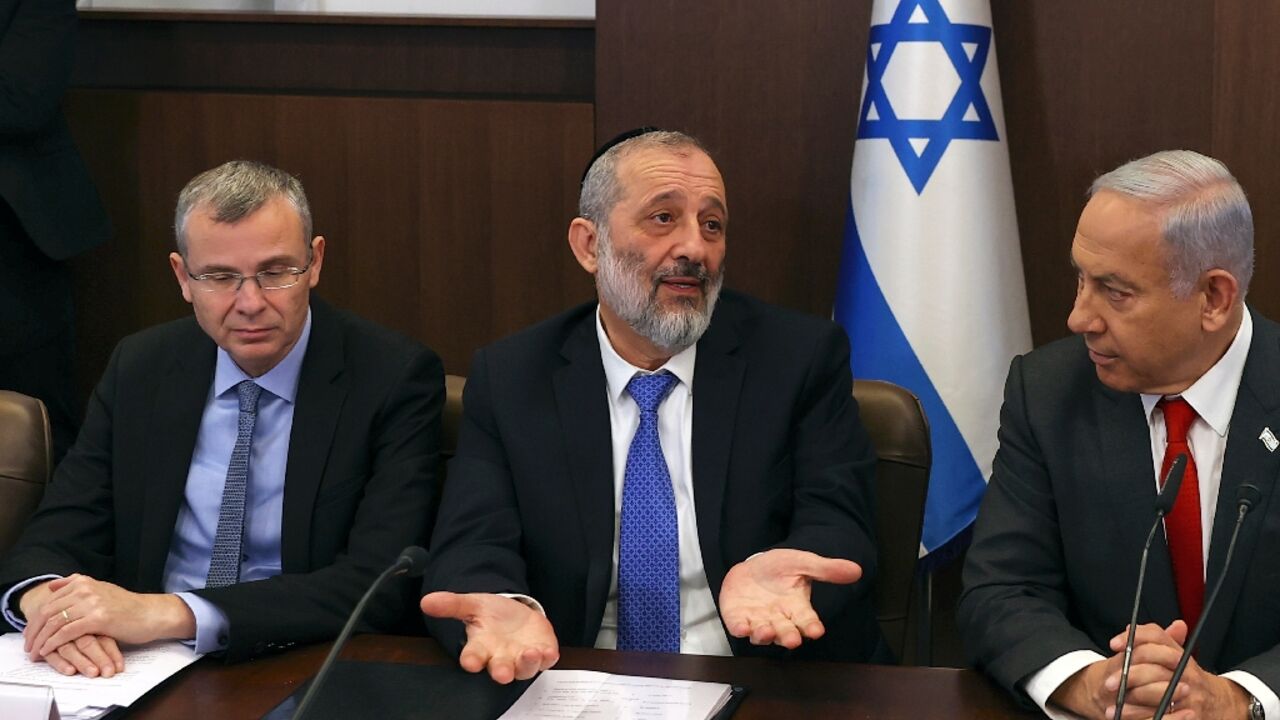 Aryeh Deri (C) said he would keep promoting the government's agenda as a party leader