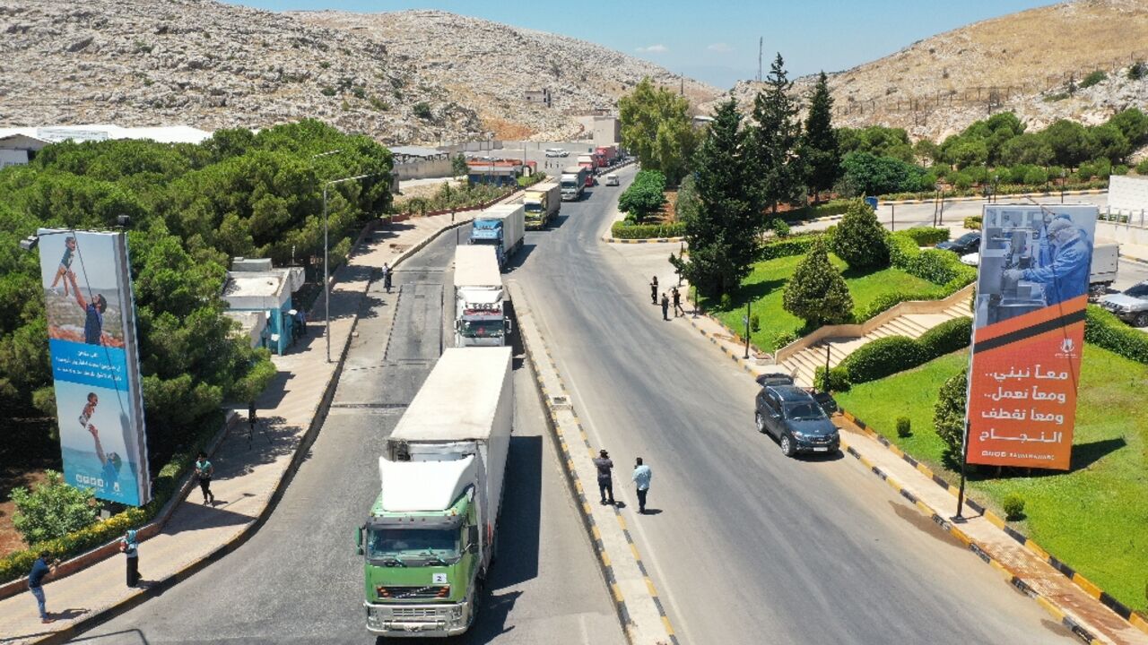 A United Nations aid convoy enters Syria through the Bab al-Hawa border crossing with Turkey