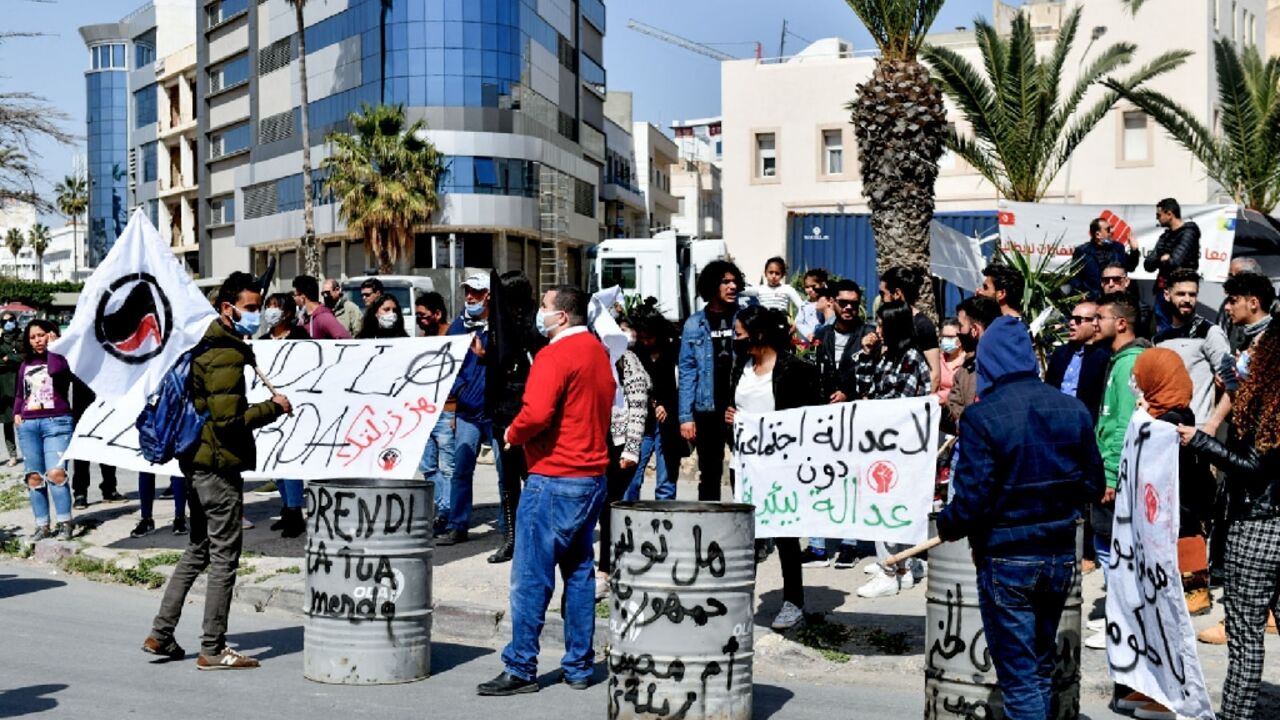 Supporters of Tunisian non-government organisations demonstrate to demand the return to Italy of household waste exported illegaly to the country, in the Mediterranean port city of Sousse, on March 28, 2021