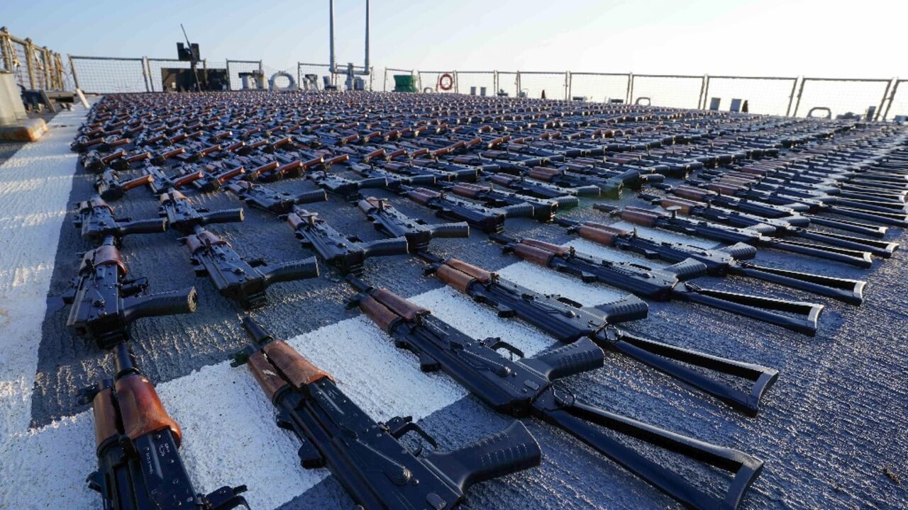 Thousands of AK-47 assault rifles are shown on the flight deck of a US guided-missile destroyer after they were reportedly seized from a fishing vessel off Oman, in a photo released by the US Navy 