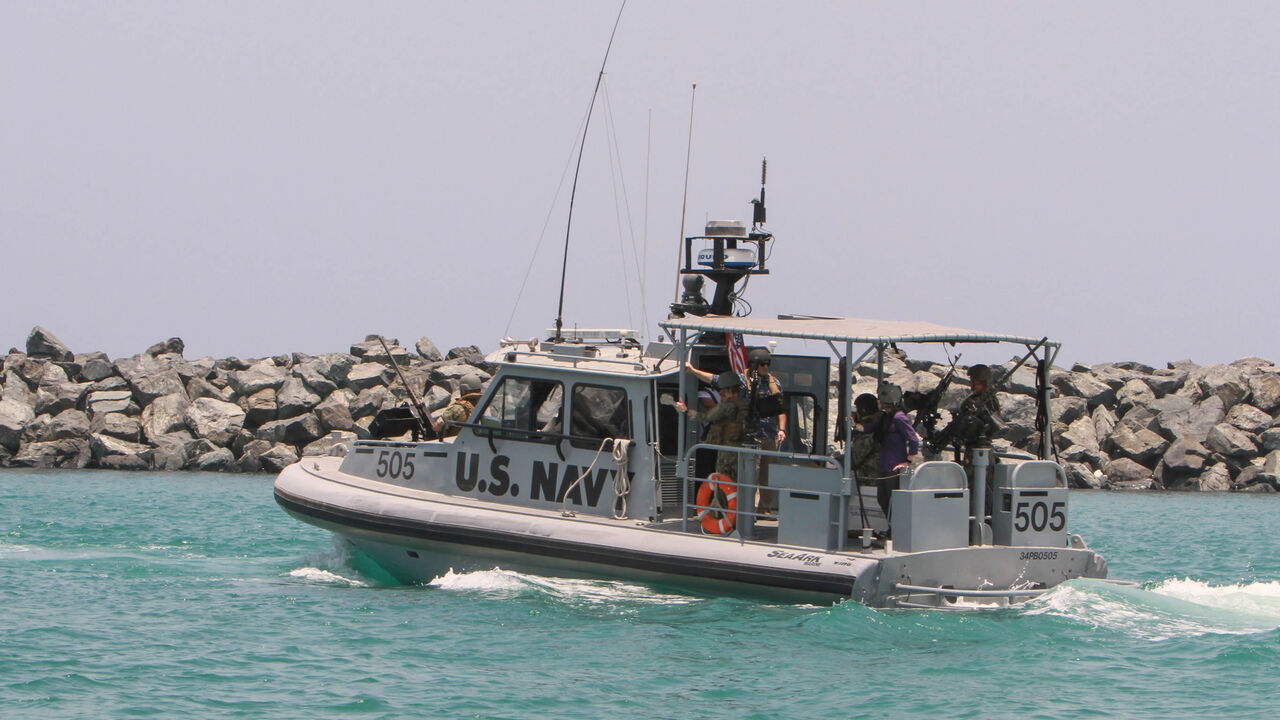 A picture taken during a guided tour by the US Navy shows a US Navy patrol boat that took journalists on board at an Emirati naval facility near the port of the Gulf emirate of Fujairah to show them an oil tanker that was attacked last week in the Gulf of Oman, June 19, 2019.
