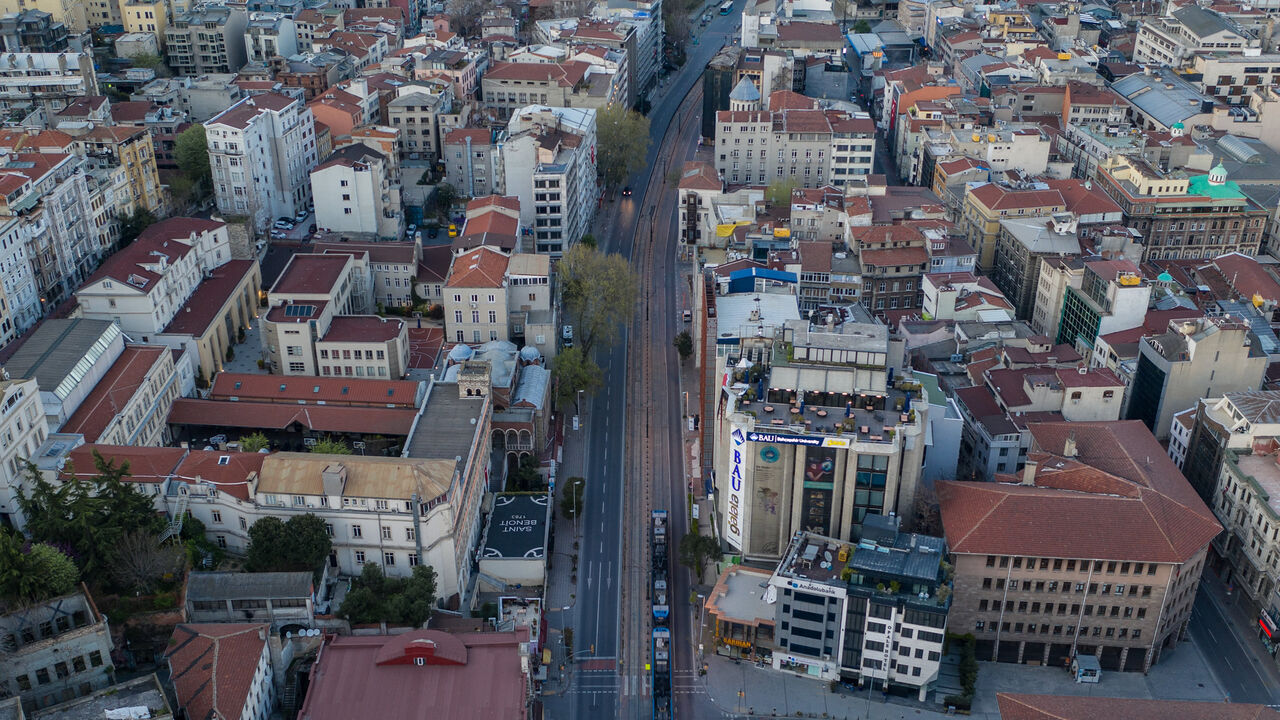 In this aerial photo from a drone, a tram passes an empty road in the Karakoy district on the final day of a four-day lockdown across Istanbul, Turkey, April 26, 2020.