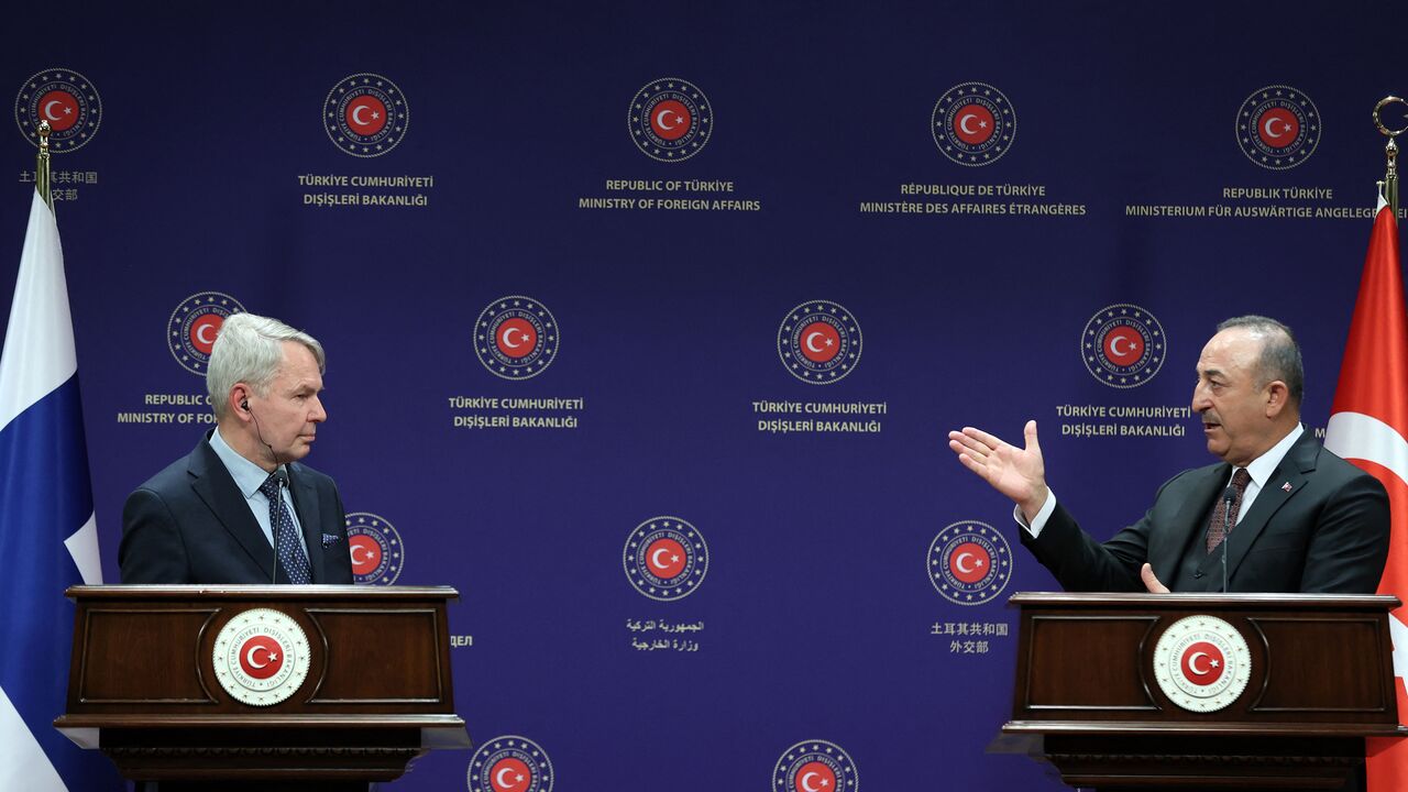 Turkish Foreign Minister Mevlut Cavusoglu (R) and Finnish Foreign Minister Pekka Haavisto (L) give a press conference following their meeting in Ankara, on February 8, 2022. (Photo by ADEM ALTAN/AFP via Getty Images)