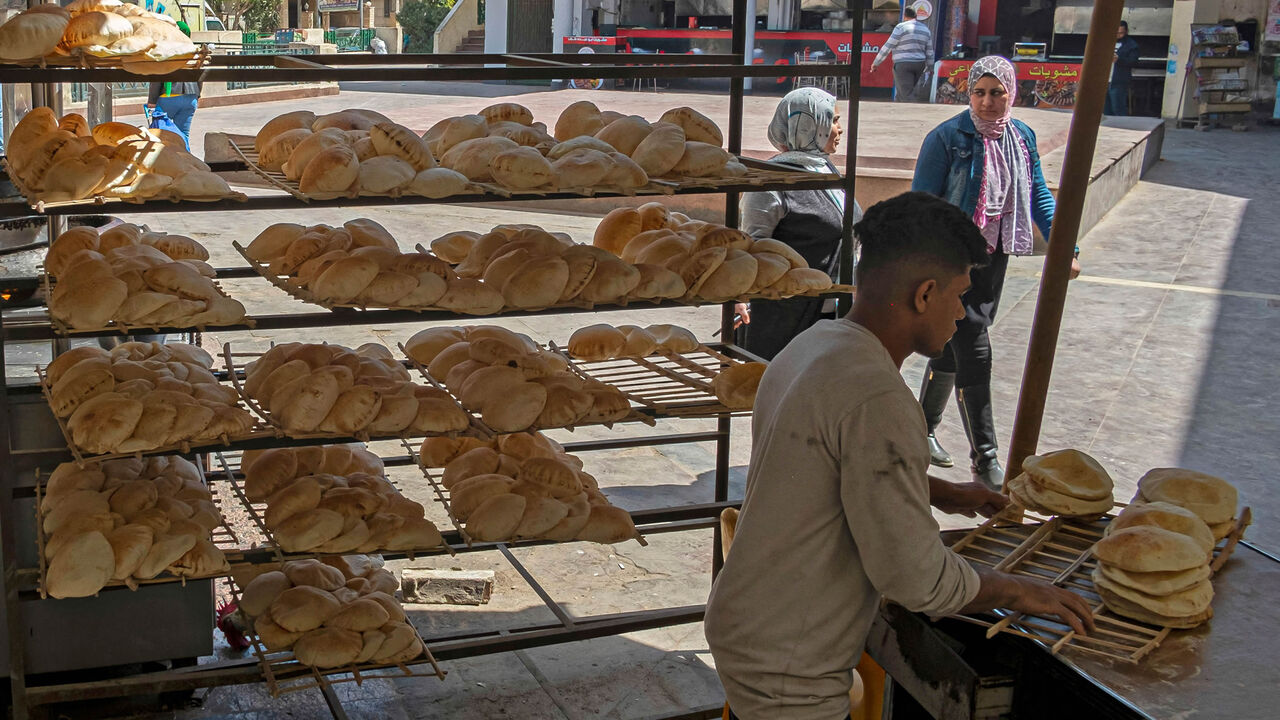 An Egyptian youth is seen working in a bakery at a market, Cairo, Egypt, March 17, 2022.