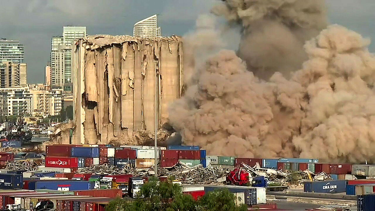 Smoke plume rising after the new collapse of the northern section of the grain silos at the port of Lebanon's capital Beirut, which were previously partly destroyed by the 2020 port explosion. (Photo by DYLAN COLLINS/AFPTV/AFP via Getty Images)