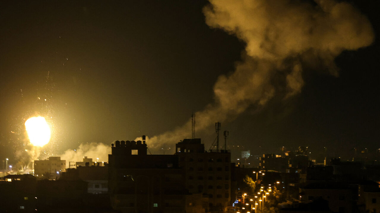 Fire and smoke rise above buildings in Gaza City as Israel launched airstrikes, Gaza Strip, early on Jan. 27, 2023.