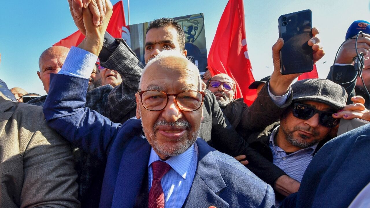 The head of Tunisia's Islamist-inspired movement Ennahdha Rached Ghannouchi greets supporters on February 21