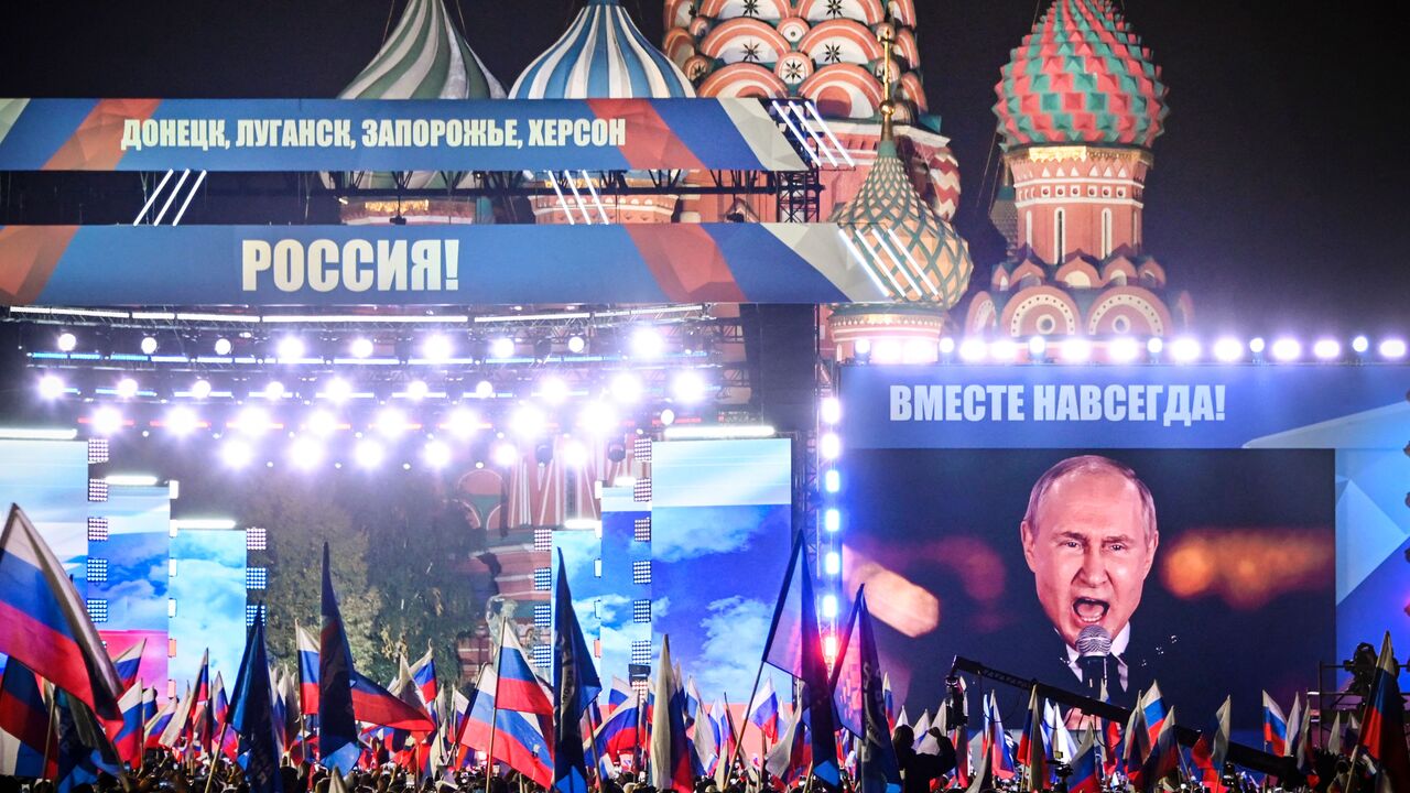 Russian President Vladimir Putin is seen on a screen set at Red Square as he addresses a rally and a concert marking the annexation of four regions of Ukraine Russian troops occupy - Lugansk, Donetsk, Kherson and Zaporizhzhia, in central Moscow on September 30, 2022. (Photo by ALEXANDER NEMENOV/AFP via Getty Images)