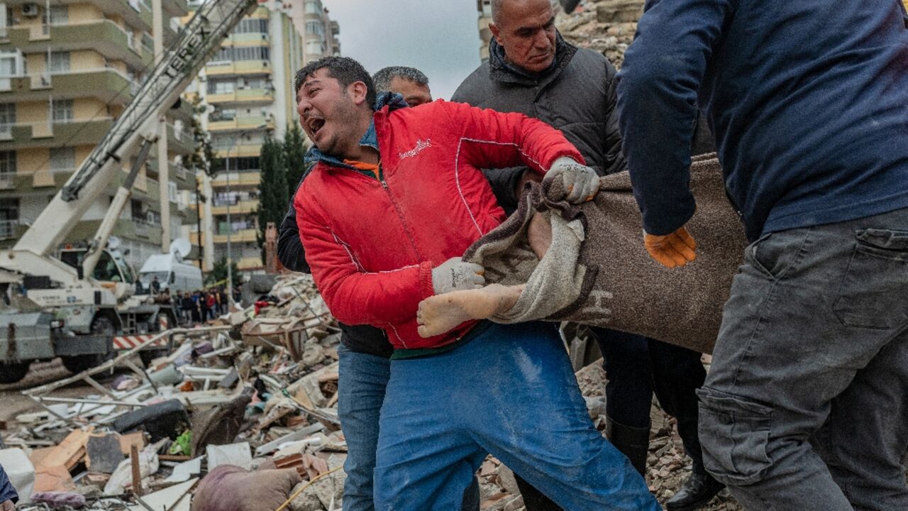 Rescuers pulled victims and survivors from buildings collapsed by an earthquake in Turkey