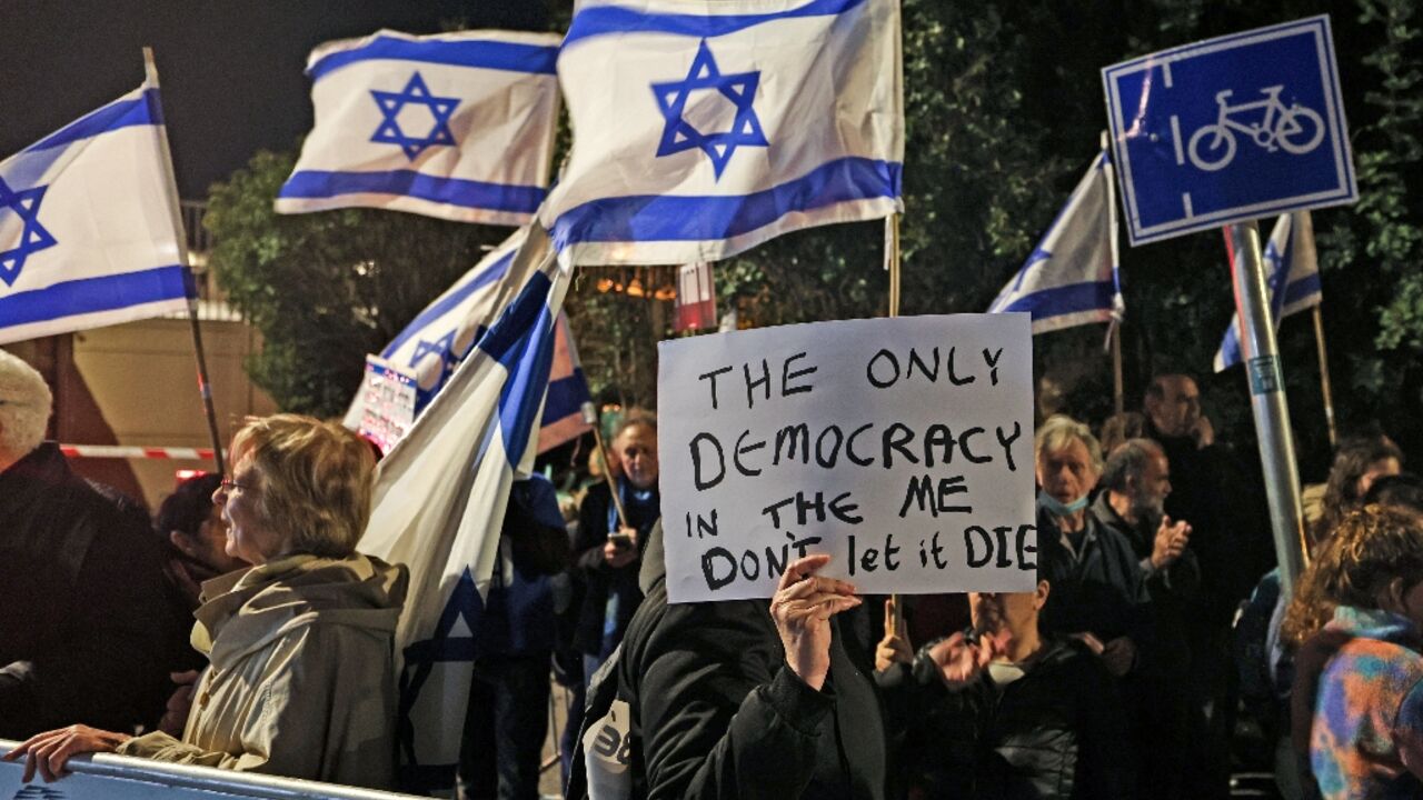 Opponents of the government's judicial reforms demonstrate outside the Israeli president's residence, the venue for the talks with opposition party representatives