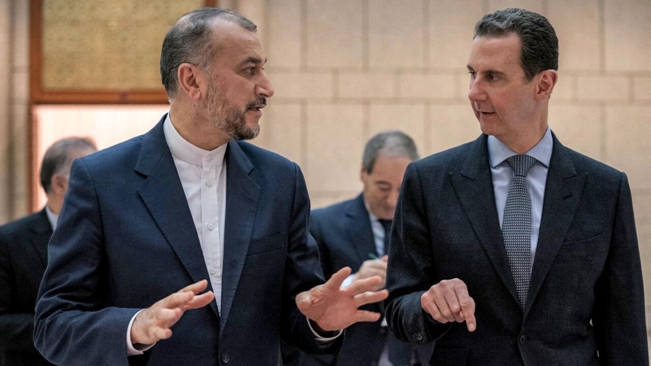 Syria's President Bashar al-Assad (R) met with Iran's Foreign Minister Hossein Amir-Abdollahian in Damascus