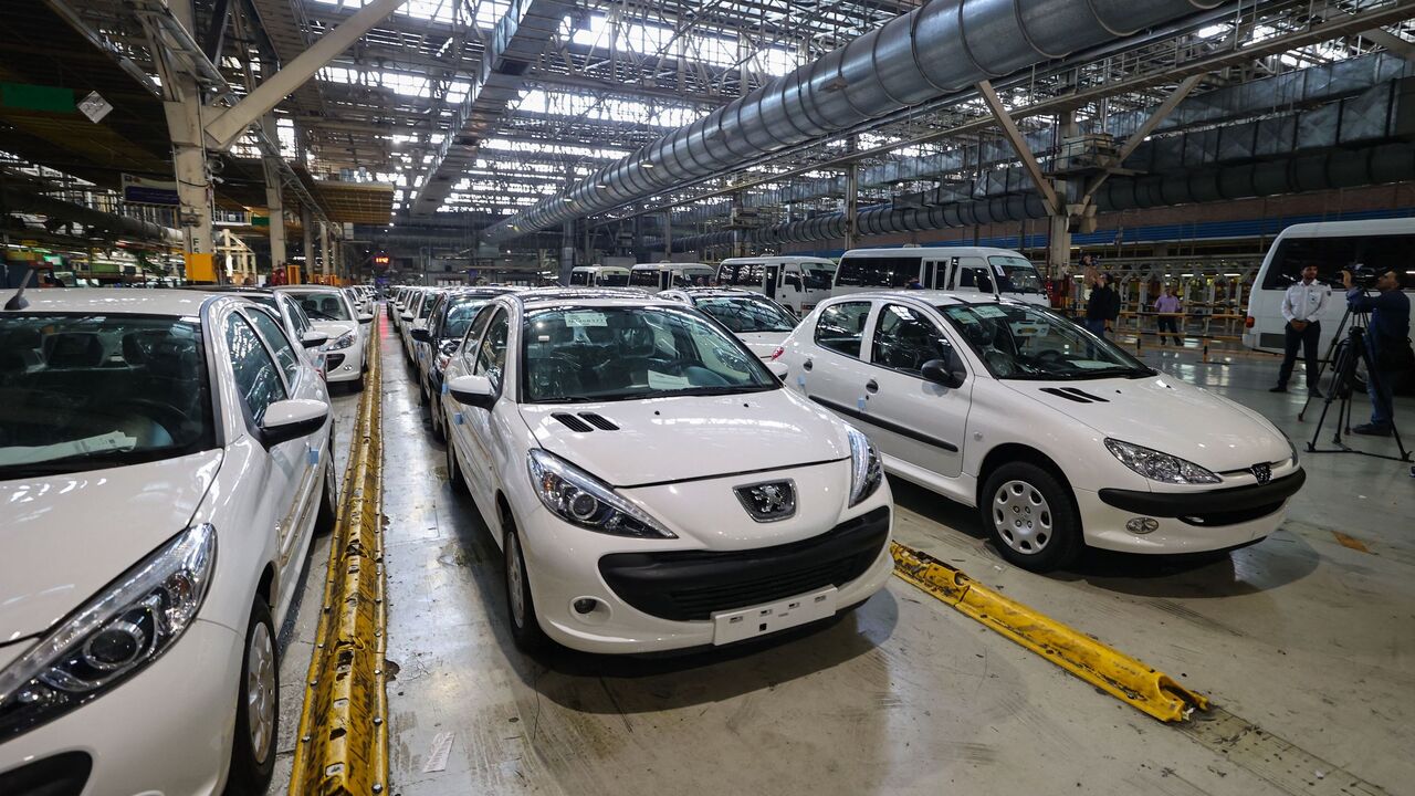 Peugeot 207 and 206 cars are parked at a hangar after exiting production lines at the Iran Khodro auto plant, west of the Iranian capital Tehran, on August 14, 2022. (Photo by ATTA KENARE / AFP) (Photo by ATTA KENARE/AFP via Getty Images)