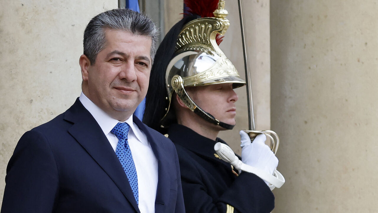 Iraqi Kurdistan Regional Government Prime Minister Masrour Barzani (L) arrives at the Elysee Presidential Palace to meet with the French president, Paris, France, Feb. 16, 2023.