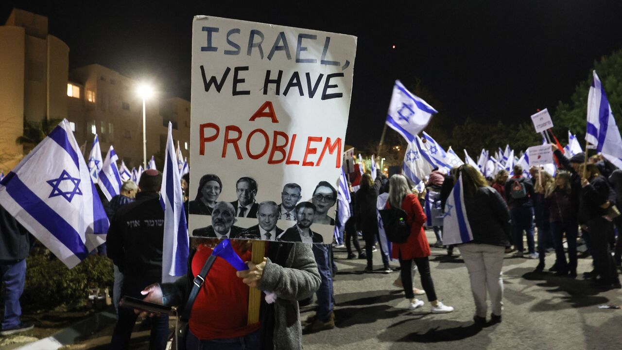 Israelis protest against the government's controversial judicial reform bill, in front of the residence of Justice Minister Yariv Levin, in the central city of Modiin, on March 9, 2022. (Photo by GIL COHEN-MAGEN / AFP) (Photo by GIL COHEN-MAGEN/AFP via Getty Images)