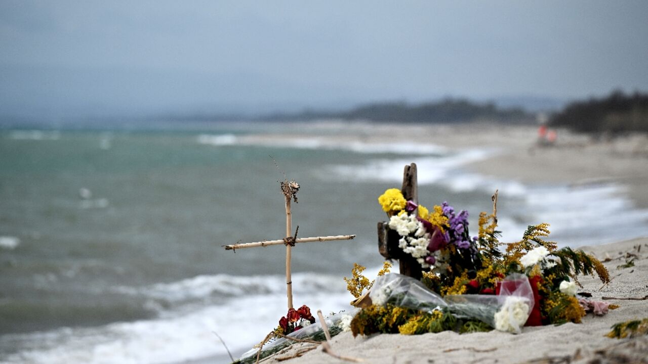 At least 72 people, including many children, perished when their overcrowded boat sank in stormy weather 