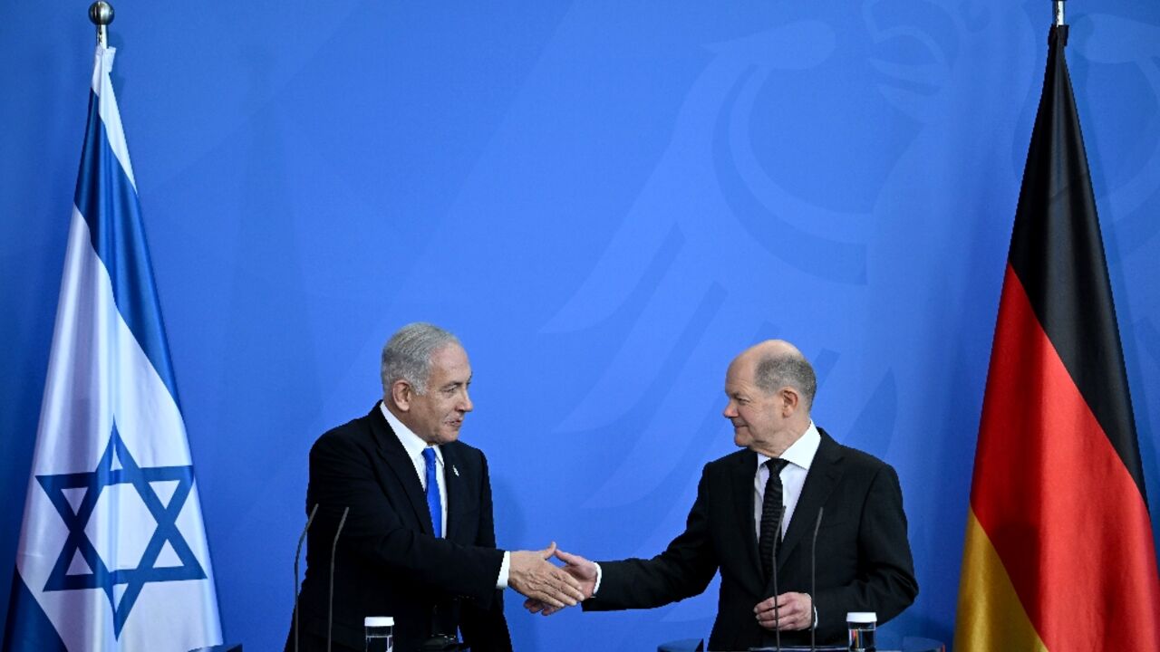 German Chancellor Olaf Scholz (R), hosting Israeli Prime Minister Benjamin Netanyahu, urged compromise on his legal reform package