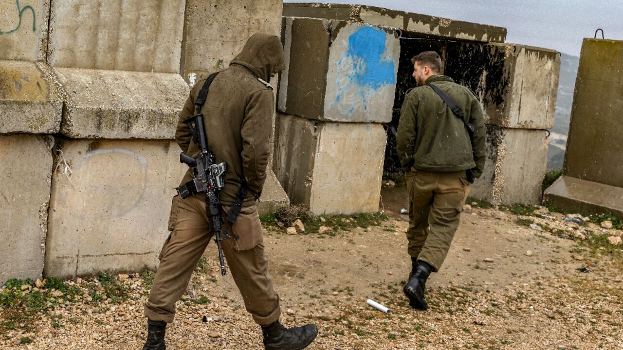 Israeli soldiers patrol the border with Lebanon near the northern village of Arab al-Aramshe after the army announced that a suspect killed inside Israel this week was wearing an explosive belt and believed to have crossed from Lebanon