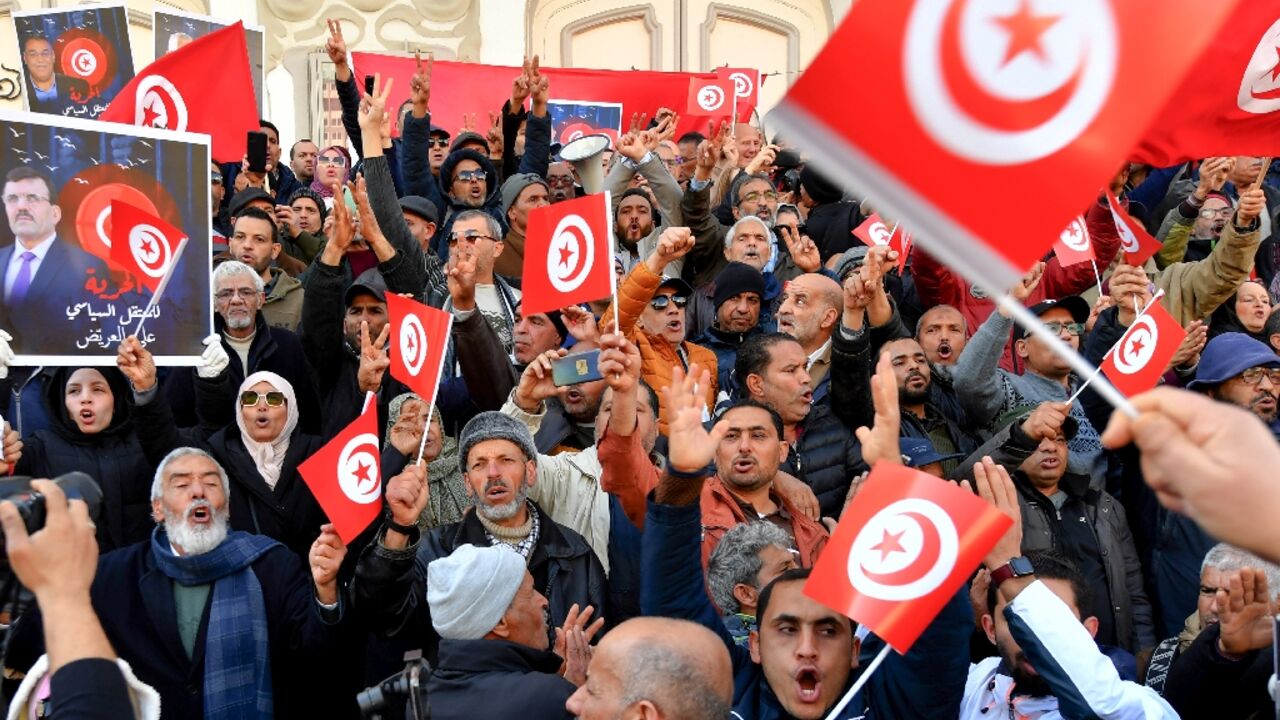 Waving their national flag, Tunisians demonstrate against their president and demand the release of detaines opposed to Kais Saied's rule