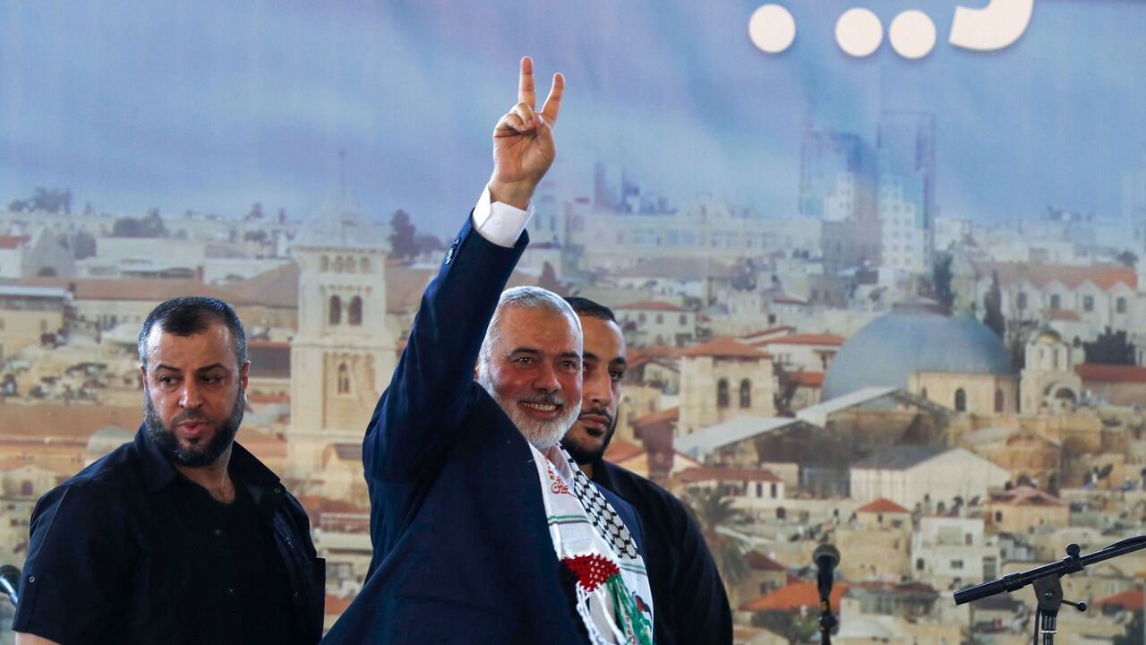 The Palestinian Hamas movement's leader Ismail Haniyeh flashes the victory sign following a speech at a public rally during his visit to the southern Lebanese city of Saida, on June 26, 2022. (Photo by MAHMOUD ZAYYAT / AFP) (Photo by MAHMOUD ZAYYAT/AFP via Getty Images)