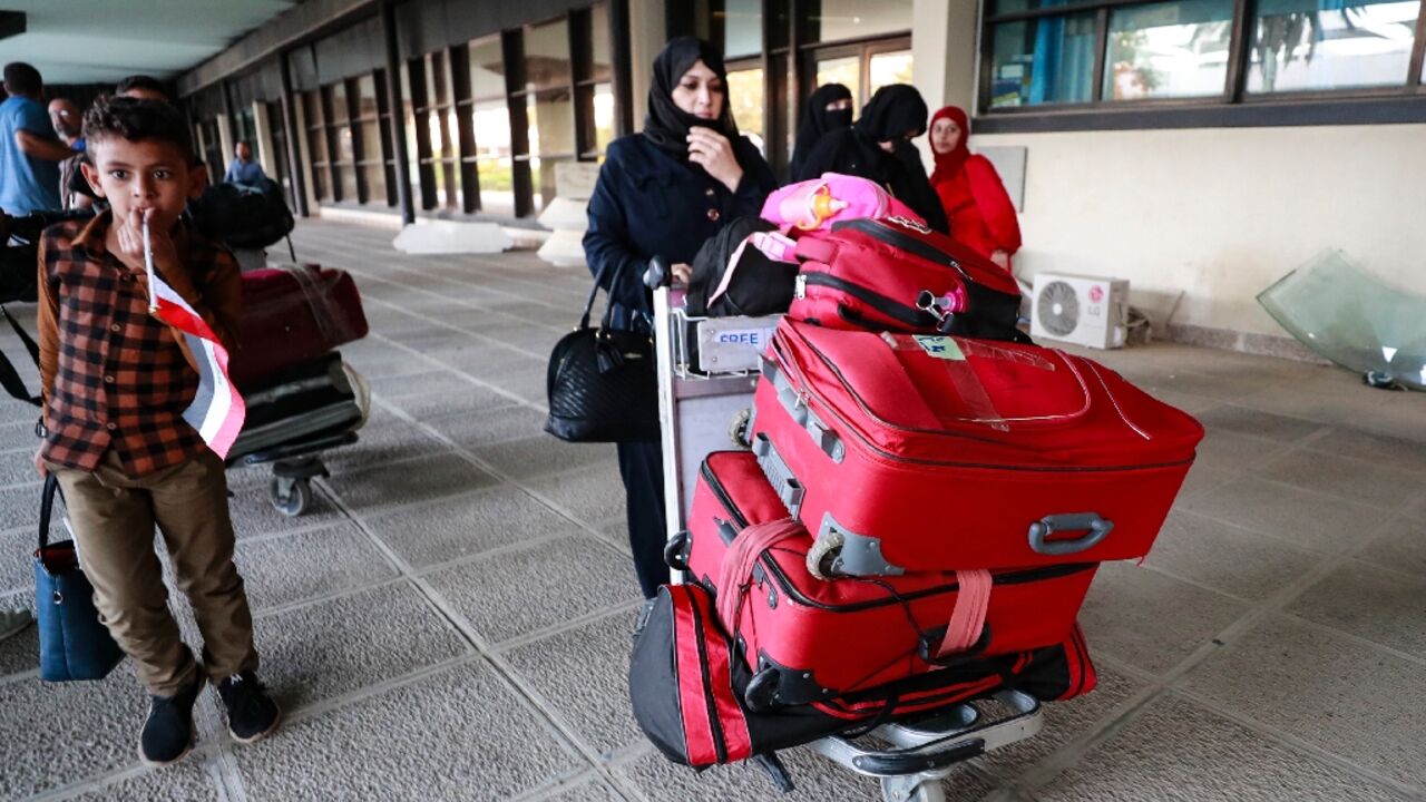Evacuees from Sudan arriving at Baghdad International Airport on April 27, 2023