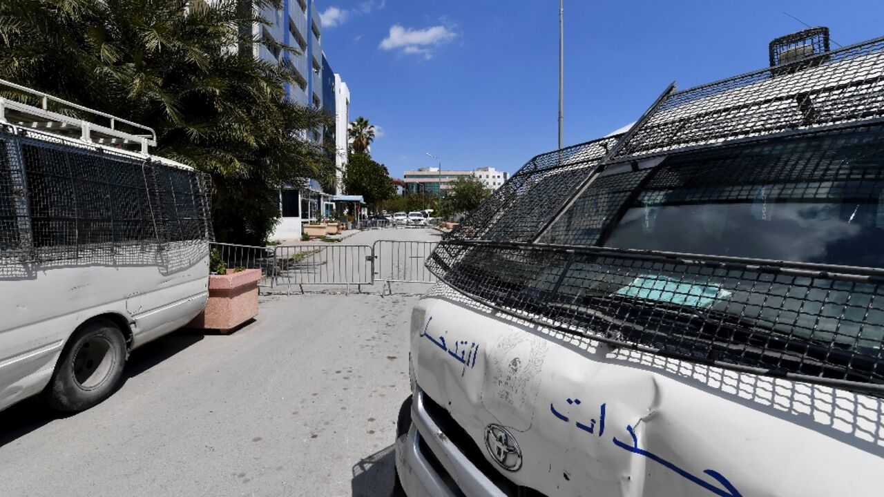 Security forces vehicles in front of the now-closed offices of Ennahdha, which was the largest party in Tunisia's parliament before President Kais Saied dissolved the chamber 