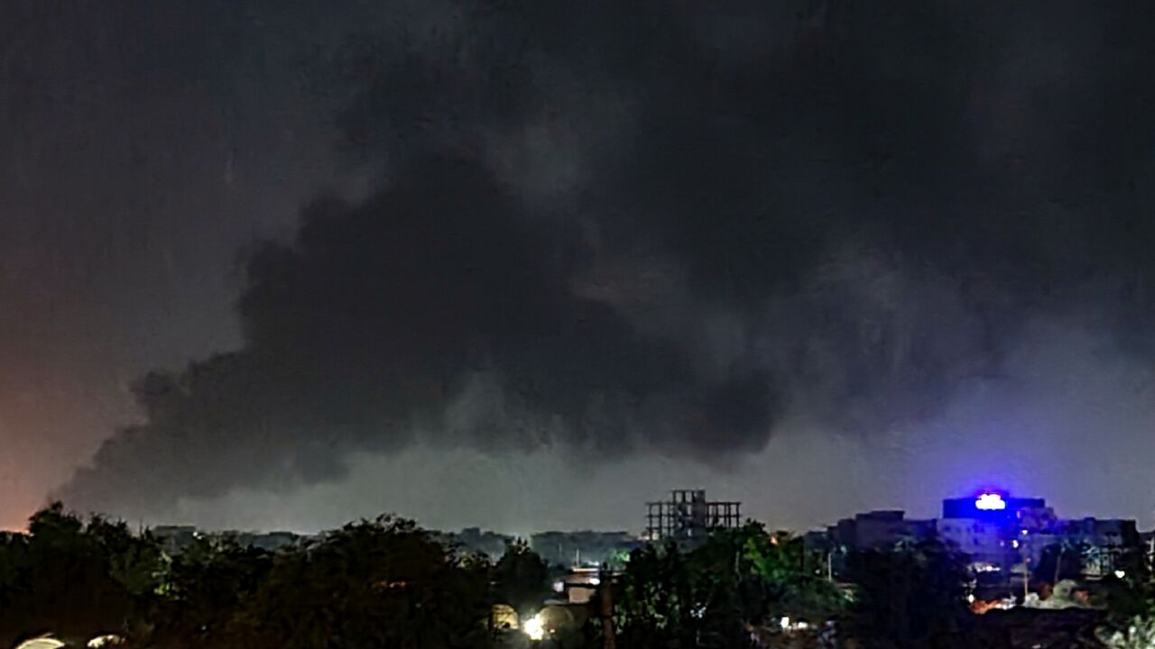 Smoke rises over Khartoum as more than one month of fighting between forces loyal to rival generals continues unabated