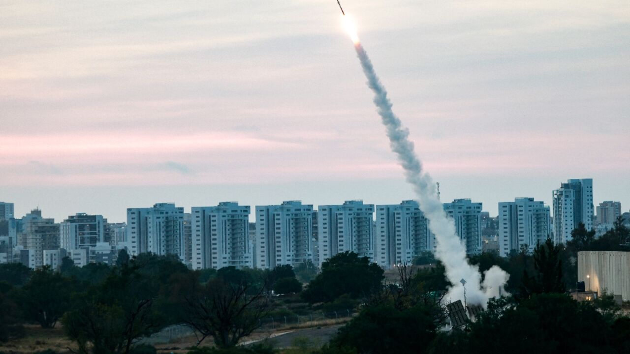 Israeli forces fire rockets from their Iron Dome defence system in the southern city of Ashkelon to intercept rockets launched from the Gaza strip, on May 10, 2023