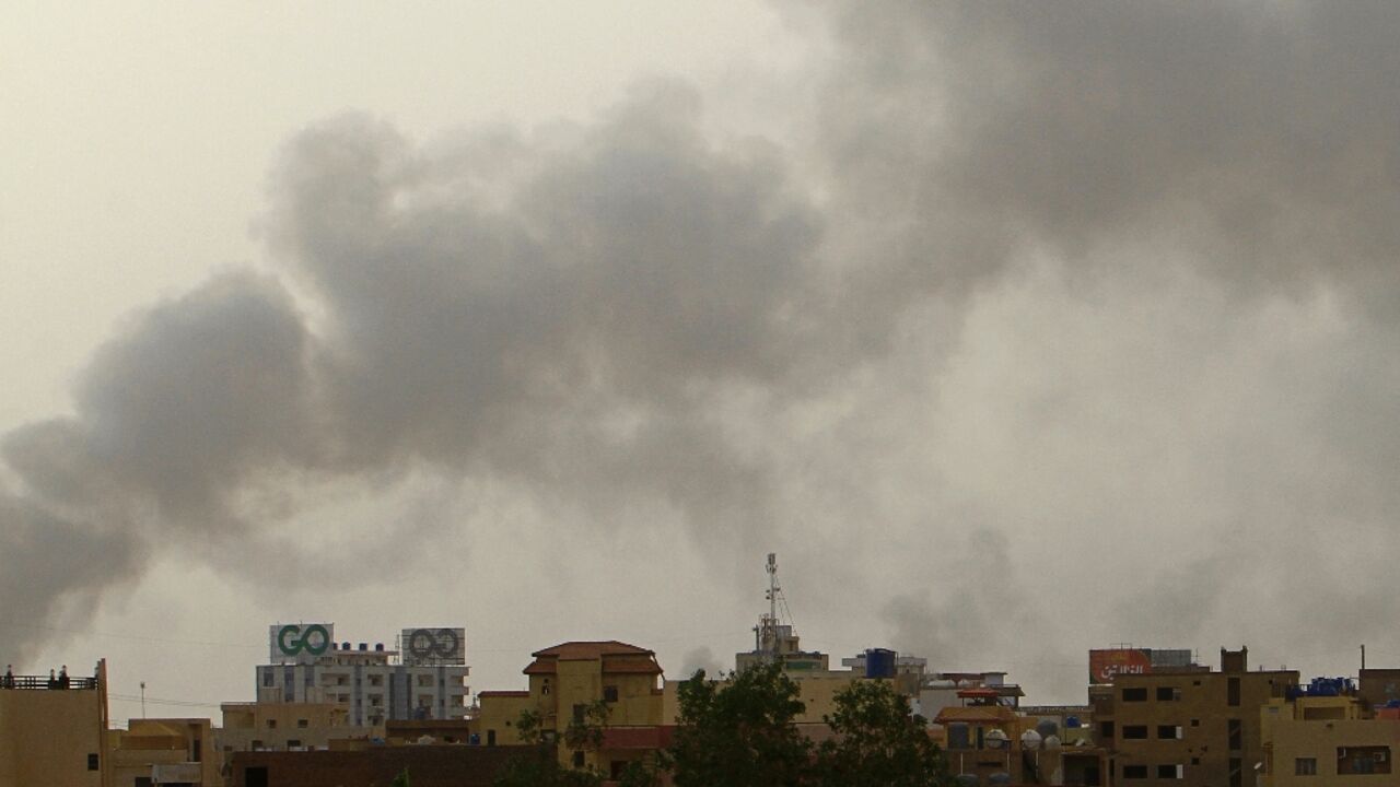 Smoke billows over buildings in southern Khartoum on May 29, 2023, amid ongoing fighting between the forces of two rival generals