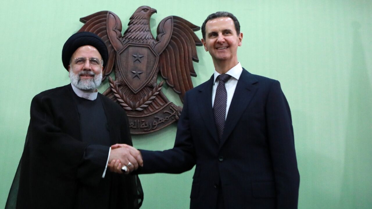 Syria's President Bashar al-Assad, on the right, with his Iranian counterpart Ebrahim Raisi in Damascus on May 3, 2023